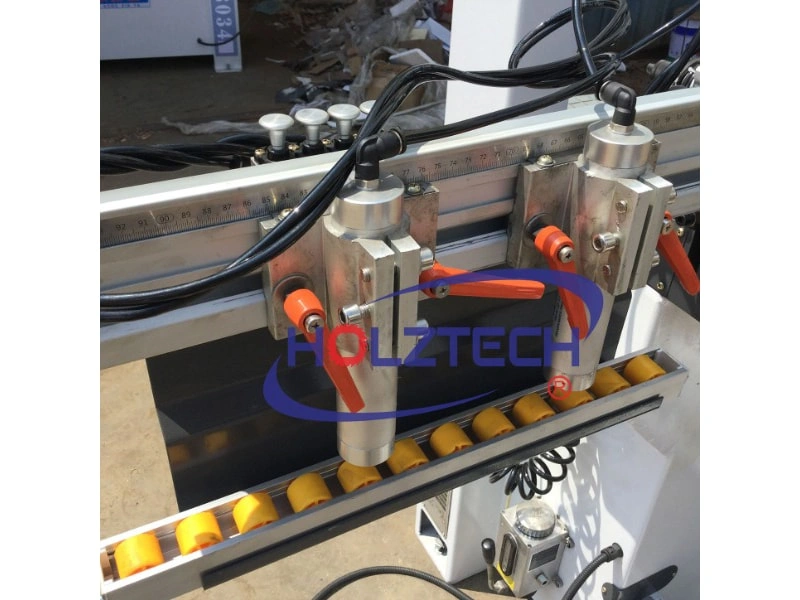 Enlarged pneumatic cylinders to clamp boards steadily.